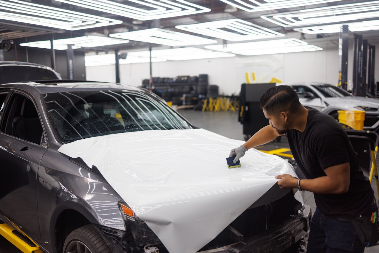Professional car wrap installation in progress